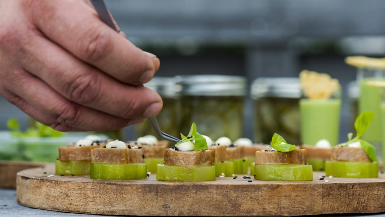Event Chef placing micro greens on top of Hors d'Oeuvres